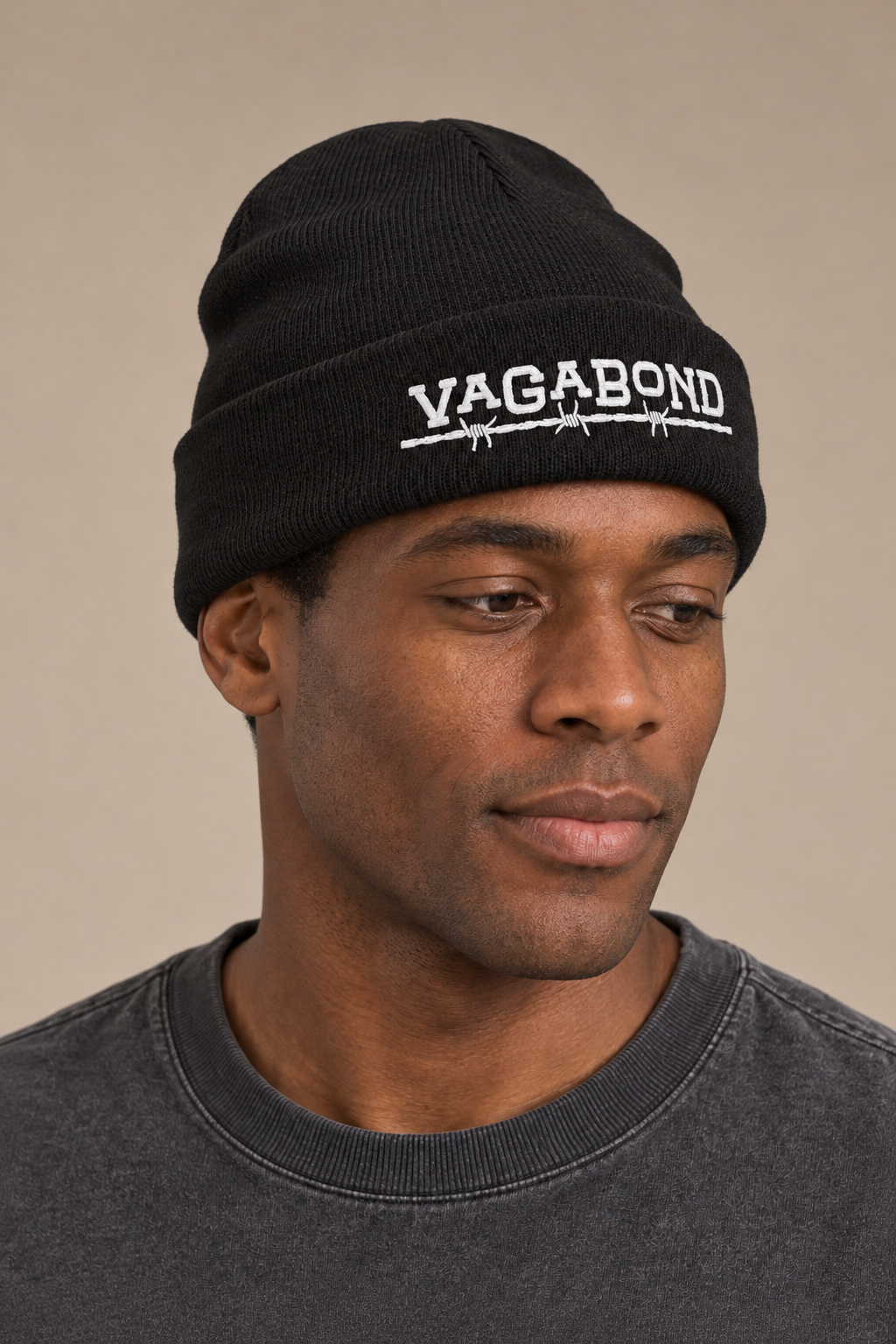 Vagabond beanie alt — model photograph against warm beige studio background