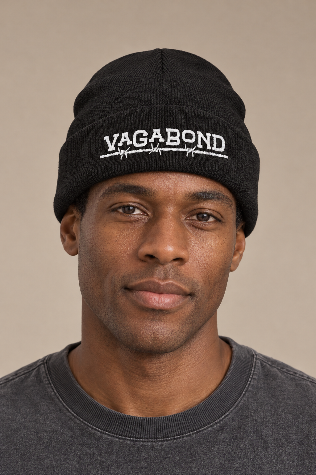 Vagabond beanie — model photograph against warm beige studio background
