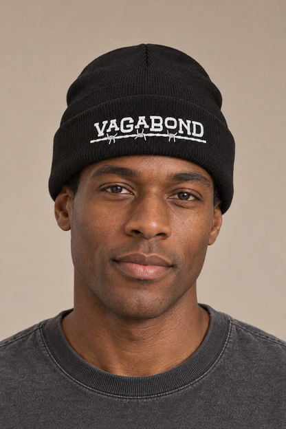 Vagabond beanie — model photograph against warm beige studio background